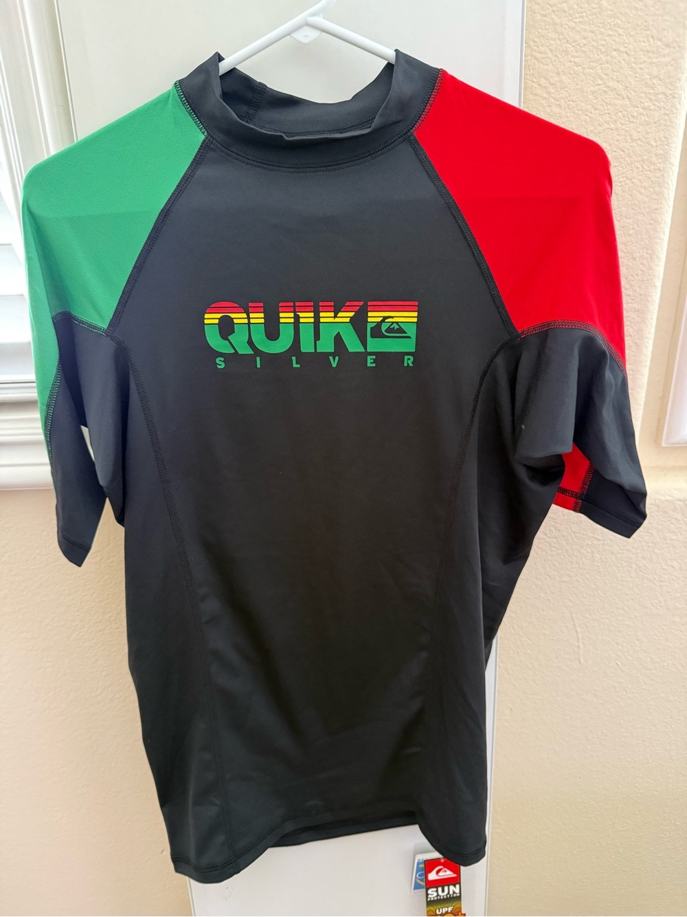 Quiksilver Black Rash Guard with Red & Yellow Tag Accents
